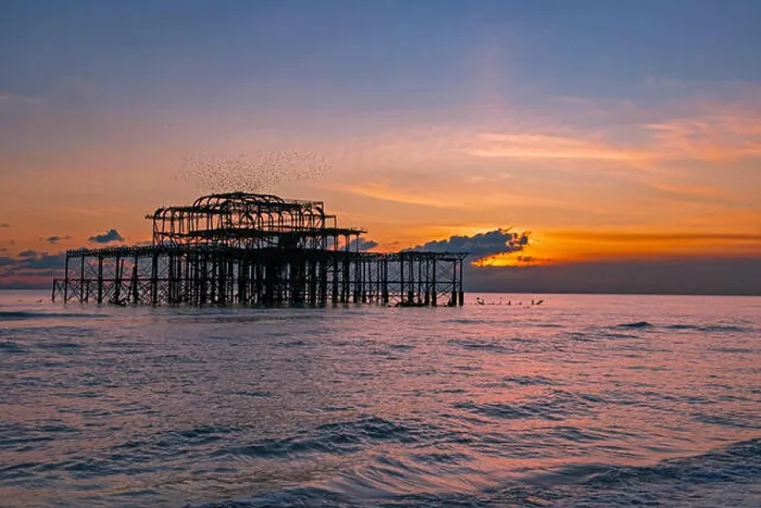 Framed Print : Murmuration over the ruins of Brighton's West Pier on the south coast of England Framed Print : Murmuration over the ruins of Brighton's West Pier on the south coast of England