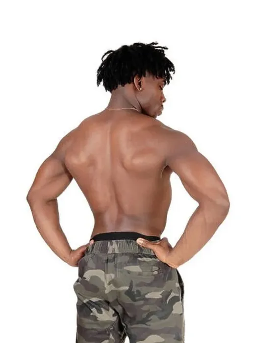 Framed Print : Muscular black man standing shirtless from the back Framed Print : Muscular black man standing shirtless from the back