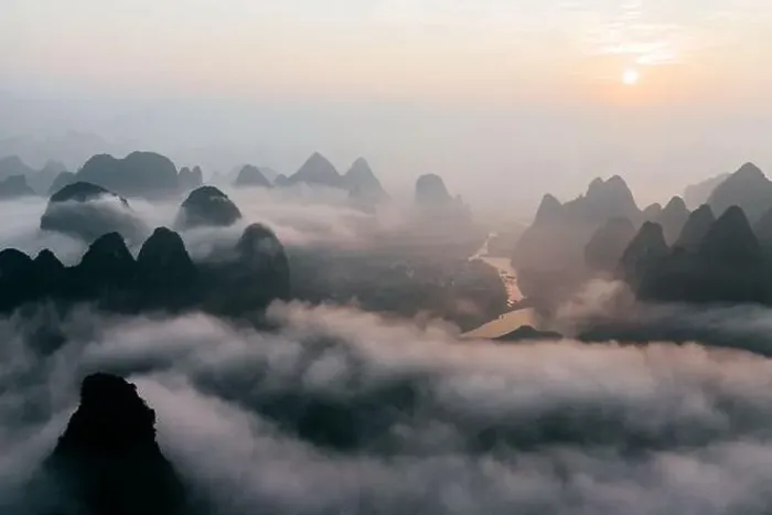 Framed Print : Mysterious river landscape among high mountains in haze Framed Print : Mysterious river landscape among high mountains in haze