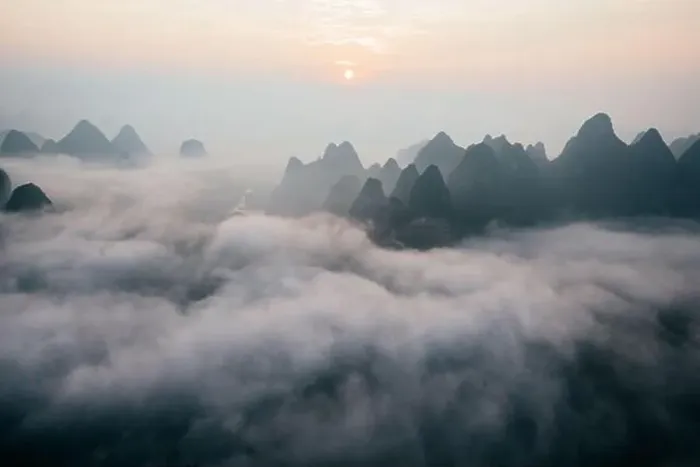 Framed Print : Mysterious river landscape among high mountains in haze Framed Print : Mysterious river landscape among high mountains in haze
