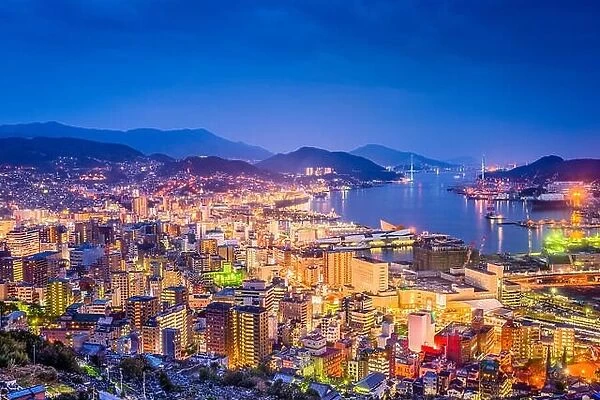Nagasaki, Japan downtown skyline over the bay from above at night