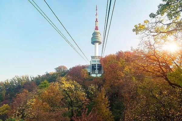 Namsan N Seoul Tower with the line of cable car at the sunset time in autumn at Seoul, South Korea