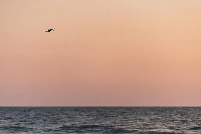 Framed Print : Naples, Florida red and orange sunset, one drone flying, in gulf of Mexico with nobody landscape, horizon, silhouette Framed Print : Naples, Florida red and orange sunset, one drone flying, in gulf of Mexico with nobody landscape, horizon, silhouette