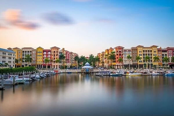 Naples, Florida, USA downtown cityscape on the bay at dusk