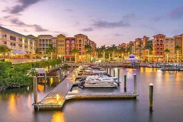 Naples, Florida, USA town skyline on the water at dusk