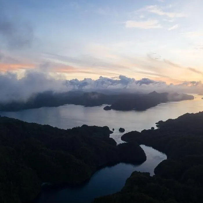 Framed Print : A narrow channel runs between beautiful limestone islands in Raja Ampat, Indonesia. This remote region is a favorite destination for scuba divers Framed Print : A narrow channel runs between beautiful limestone islands in Raja Ampat, Indonesia. This remote region is a favorite destination for scuba divers