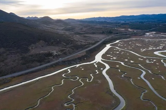 Framed Print : Narrow channels meander through a beautiful estuary in Central California. Estuaries form when freshwater runoff meets and mixes with seawater Framed Print : Narrow channels meander through a beautiful estuary in Central California. Estuaries form when freshwater runoff meets and mixes with seawater