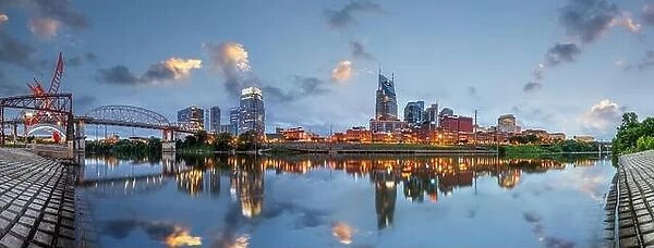 Nashville, Tenessee, USA downtown city skyline on the Cumberland River at twilight