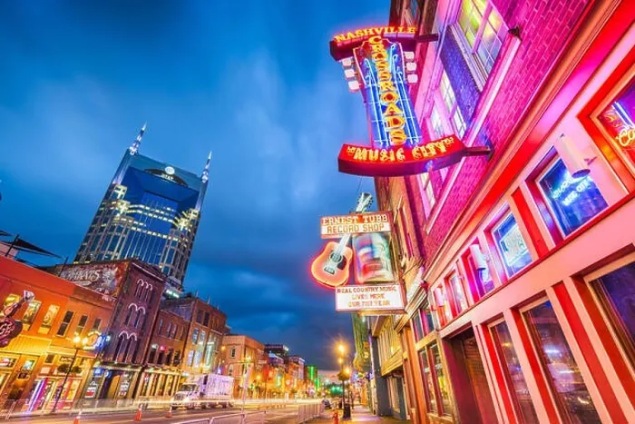 Framed Print : NASHVILLE, TENNESSEE - AUGUST 20, 2018: Honky-tonks on Lower Broadway. The district is famous for the numerous country music entertainment establishme Framed Print : NASHVILLE, TENNESSEE - AUGUST 20, 2018: Honky-tonks on Lower Broadway. The district is famous for the numerous country music entertainment establishme