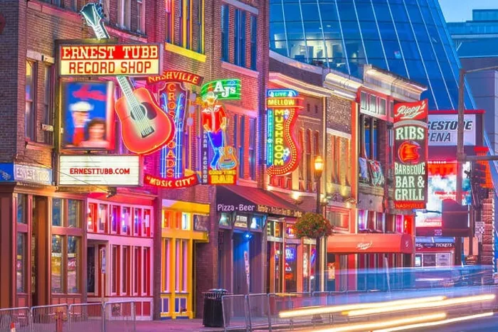 Framed Print : NASHVILLE, TENNESSEE - AUGUST 20, 2018: Honky-tonks on Lower Broadway. The district is famous for the numerous country music entertainment establishme Framed Print : NASHVILLE, TENNESSEE - AUGUST 20, 2018: Honky-tonks on Lower Broadway. The district is famous for the numerous country music entertainment establishme