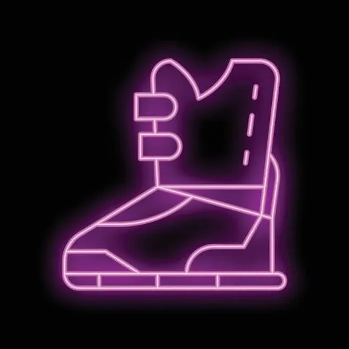 Framed Print : Neon sign showing a hiking boot, glowing pink against a black background Framed Print : Neon sign showing a hiking boot, glowing pink against a black background