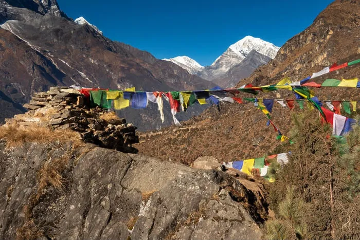 Framed Print : Nepal, Namche Bazar, prayer flags flying from rough rocky chorten, Kongde Ri and Pachermo peak behind Framed Print : Nepal, Namche Bazar, prayer flags flying from rough rocky chorten, Kongde Ri and Pachermo peak behind