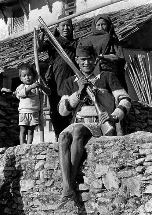 Framed Print : A Nepali man with an old rifle and his family in the middle hills village of Siklis - Nepal Framed Print : A Nepali man with an old rifle and his family in the middle hills village of Siklis - Nepal