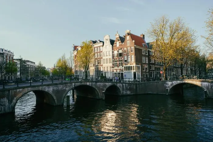 Framed Print : Netherlands traditional houses and Amsterdam canal in Amsterdam, Netherlands. Vintage tone Framed Print : Netherlands traditional houses and Amsterdam canal in Amsterdam, Netherlands. Vintage tone