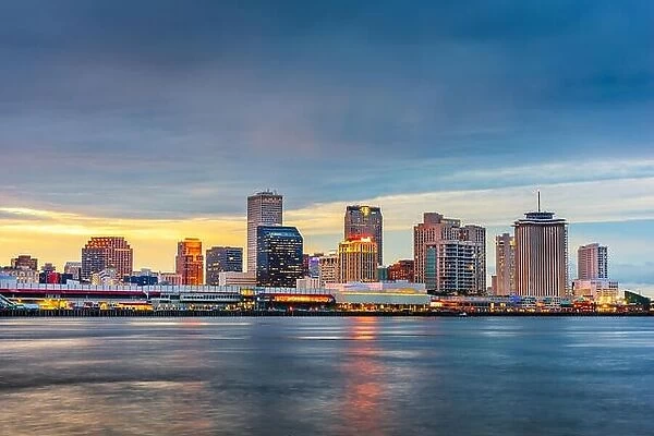New Orleans, Louisiana, USA night skyline on the Mississippi River at dusk