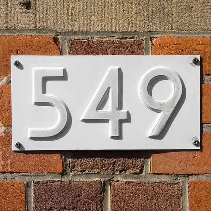 Framed Print : New white house number five hundred and forty-nine, embossed in a metal plate Framed Print : New white house number five hundred and forty-nine, embossed in a metal plate