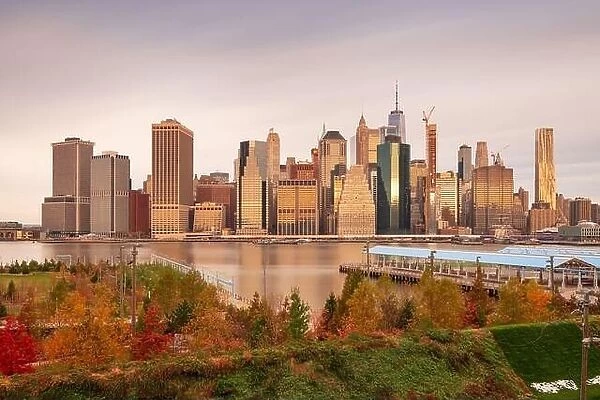 New York City skyline from across the East River with autumn seasonal foliage