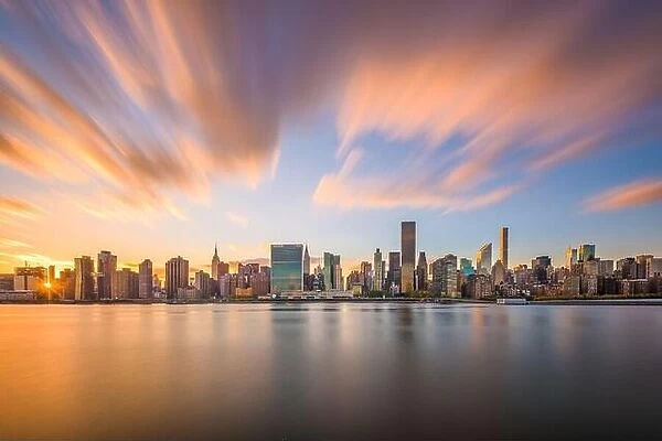 New York City skyline on the East River with Midtown Manhattan at sunset