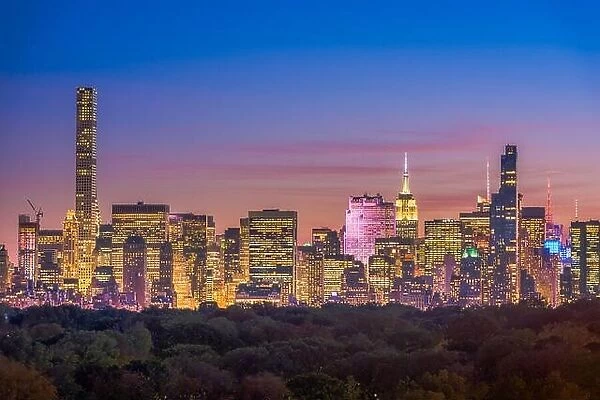 New York, New York midtown Manhattan cityscape over Central Park at twilight