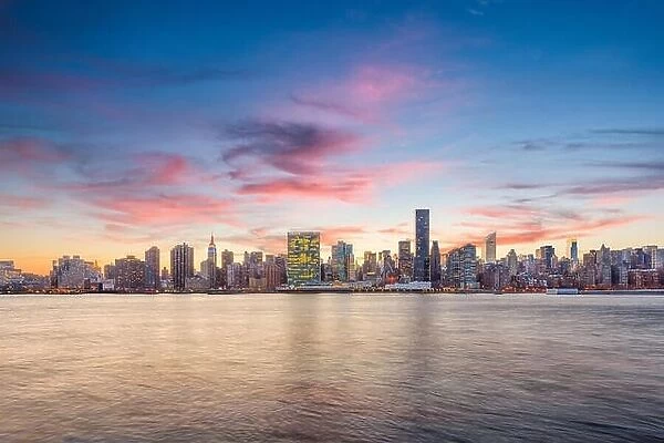 New York, New York, USA city skyline from across the East River at dusk