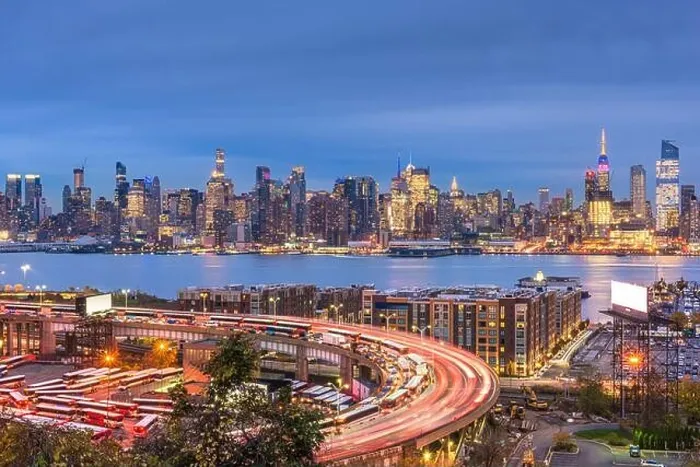Framed Print : New York, New York, USA cityscape and highways from across the Hudson River at dusk Framed Print : New York, New York, USA cityscape and highways from across the Hudson River at dusk