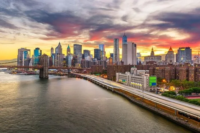 Framed Print : New York, New York, USA downtown Manhattan city skyline over the East River with the Brooklyn Bridge at dusk Framed Print : New York, New York, USA downtown Manhattan city skyline over the East River with the Brooklyn Bridge at dusk