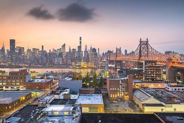New York, New York, USA Manhattan skyline with the Queensboro Bridge