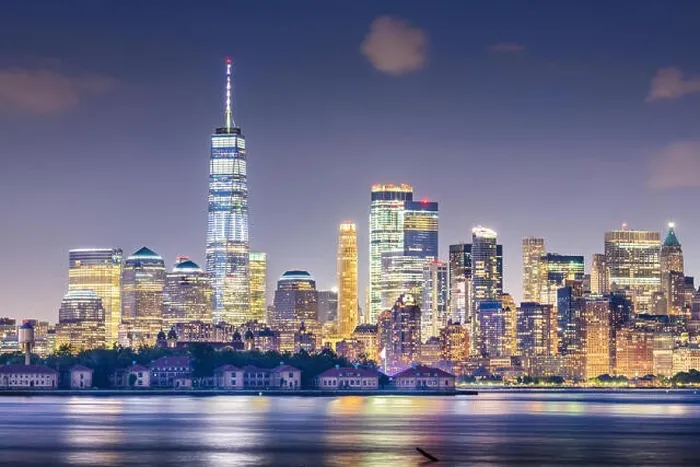 Framed Print : New York, New York, USA skyline from the harbor with Ellis Island at night Framed Print : New York, New York, USA skyline from the harbor with Ellis Island at night