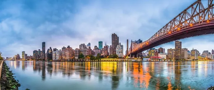 Framed Print : New York, New York, USA skyline of Manhattan from across the East River with Queensboro Bridge at dusk Framed Print : New York, New York, USA skyline of Manhattan from across the East River with Queensboro Bridge at dusk