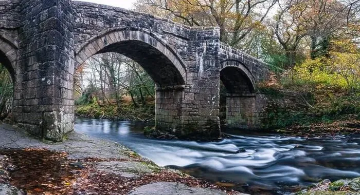 Framed Print : Newbridge in Autumn Colours over the River Dart in long exposure, Dartmoor Park, Devon, England, Europe Framed Print : Newbridge in Autumn Colours over the River Dart in long exposure, Dartmoor Park, Devon, England, Europe