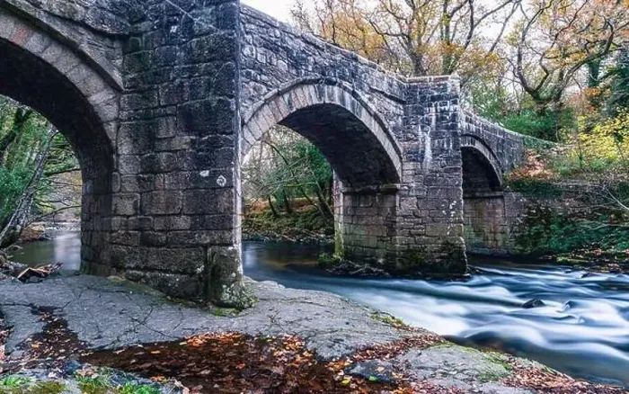 Framed Print : Newbridge in Autumn Colours over the River Dart in long exposure, Dartmoor Park, Devon, England, Europe Framed Print : Newbridge in Autumn Colours over the River Dart in long exposure, Dartmoor Park, Devon, England, Europe