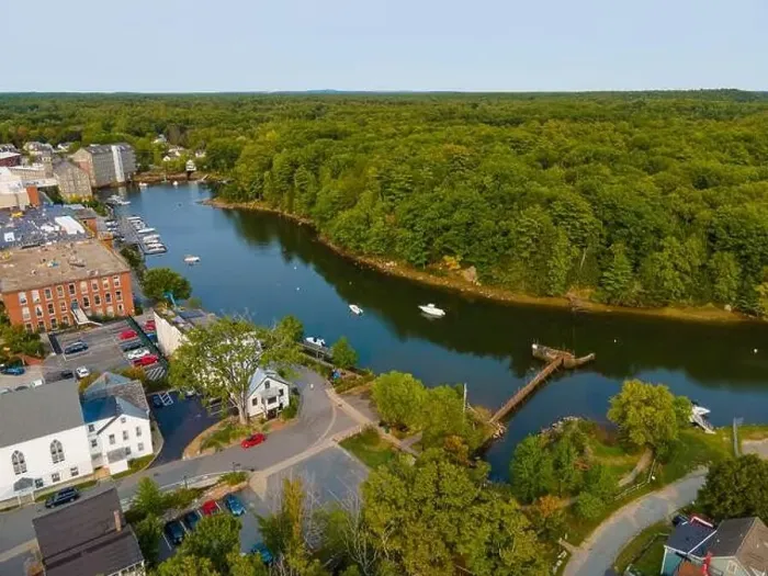 Framed Print : Newmarket Mills building aerial view on Lamprey River on Main Street in historic town center of Newmarket Framed Print : Newmarket Mills building aerial view on Lamprey River on Main Street in historic town center of Newmarket