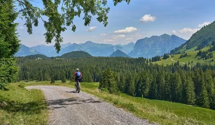 Framed Print : nice, active senior woman underway with her electric mountain bike in the Bregenz Forest near Dornbirn Framed Print : nice, active senior woman underway with her electric mountain bike in the Bregenz Forest near Dornbirn