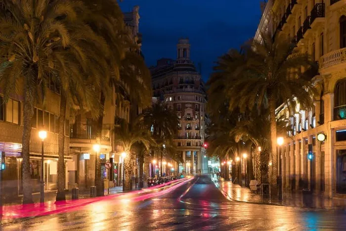 Framed Print : Night street view in Valencia downtown, Spain. Palm Trees in Spanish City of Valencia Framed Print : Night street view in Valencia downtown, Spain. Palm Trees in Spanish City of Valencia
