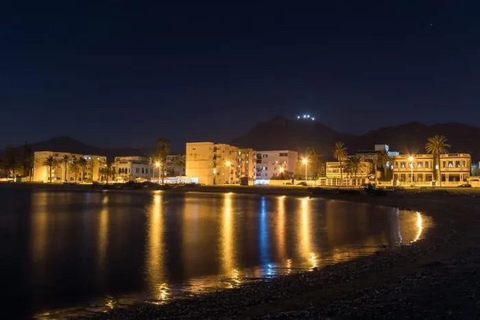 Framed Print : A Night View of Houses and Street Lights by the Sea in Tunis Framed Print : A Night View of Houses and Street Lights by the Sea in Tunis