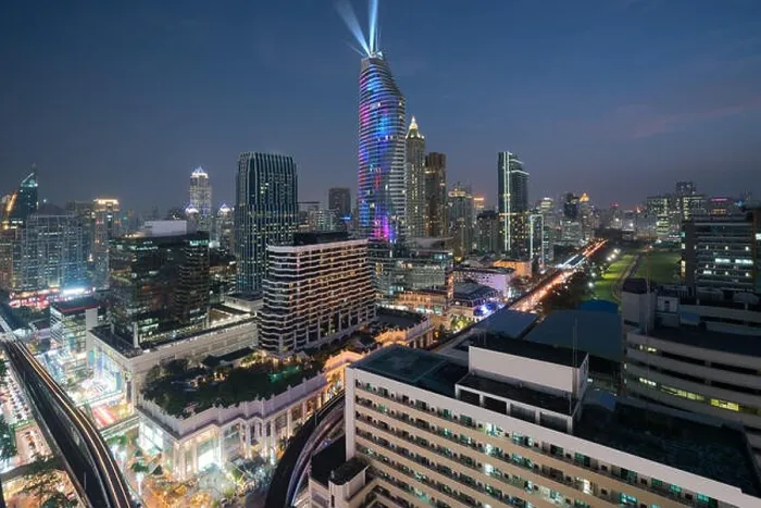 Framed Print : Night view with skyscraper in business district in Bangkok Thailand. Light show at Magnolias Ratchaprasong in Bangkok, Thailand Framed Print : Night view with skyscraper in business district in Bangkok Thailand. Light show at Magnolias Ratchaprasong in Bangkok, Thailand