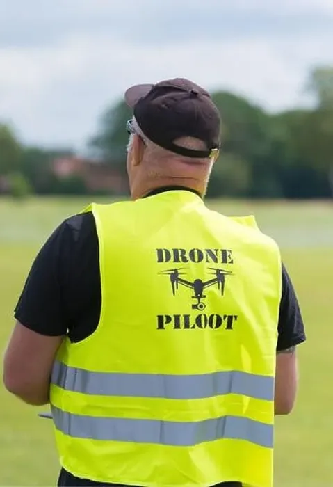 Framed Print : NIJVERDAL, NETHERLANDS - JUNE 23, 2018: Professional drone pilot controling a drone with camera Framed Print : NIJVERDAL, NETHERLANDS - JUNE 23, 2018: Professional drone pilot controling a drone with camera