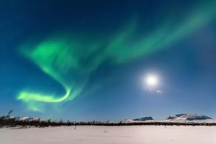 Framed Print : Northern Lights (Aurora Borealis) at full moon over snow-covered mountains Framed Print : Northern Lights (Aurora Borealis) at full moon over snow-covered mountains