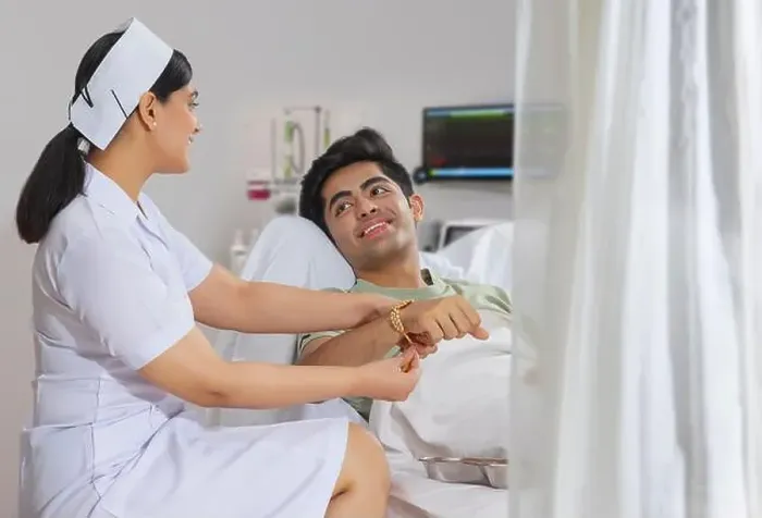 Framed Print : NURSE IN THE ROLE OF A SISTER TYING RAKHI TO THE BOY ADMITTED IN THE HOSPITAL Framed Print : NURSE IN THE ROLE OF A SISTER TYING RAKHI TO THE BOY ADMITTED IN THE HOSPITAL