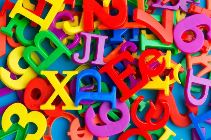 Framed Print : object on blue - toy plastic letters and numbers Framed Print : object on blue - toy plastic letters and numbers
