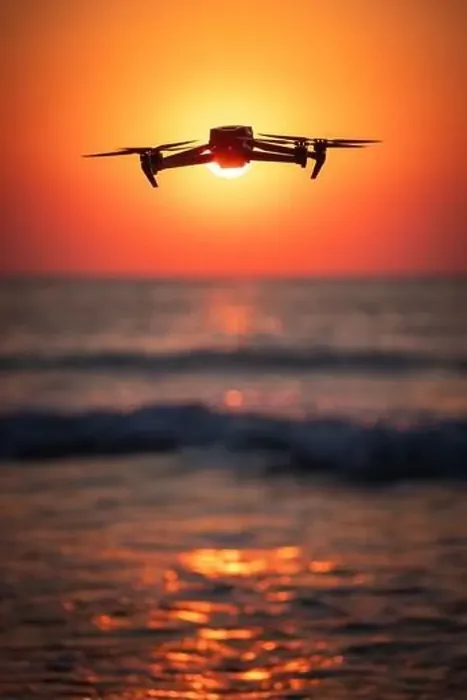 Framed Print : Ocean beach sunrise and flying drone against sun and sea horizon Framed Print : Ocean beach sunrise and flying drone against sun and sea horizon