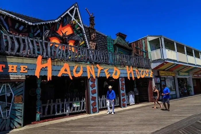 Framed Print : Ocean City, MD, USA - May 26, 2018: A Haunted House amusement located on the Ocean City boardwalk Framed Print : Ocean City, MD, USA - May 26, 2018: A Haunted House amusement located on the Ocean City boardwalk