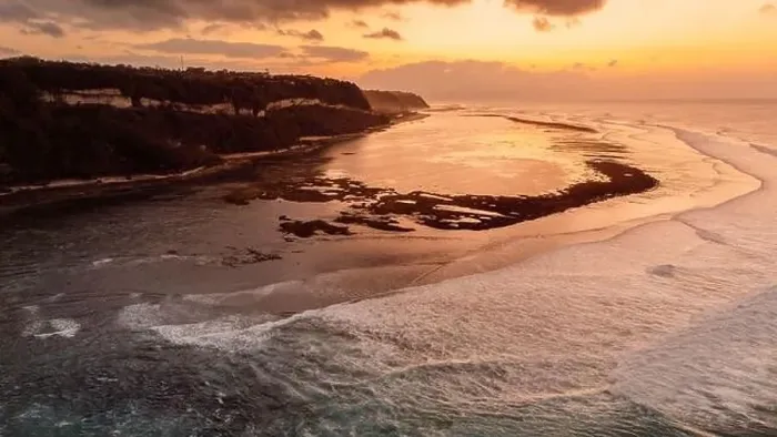 Framed Print : Ocean coastline with waves on low tide and sunrise tones. Drone view Framed Print : Ocean coastline with waves on low tide and sunrise tones. Drone view