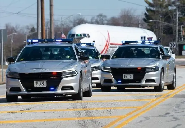 Framed Print : Ohio State Highway Patrol officers escort the fuselage of a Boeing 767 as it moves along Kauffman Avenue in Fairborn Framed Print : Ohio State Highway Patrol officers escort the fuselage of a Boeing 767 as it moves along Kauffman Avenue in Fairborn