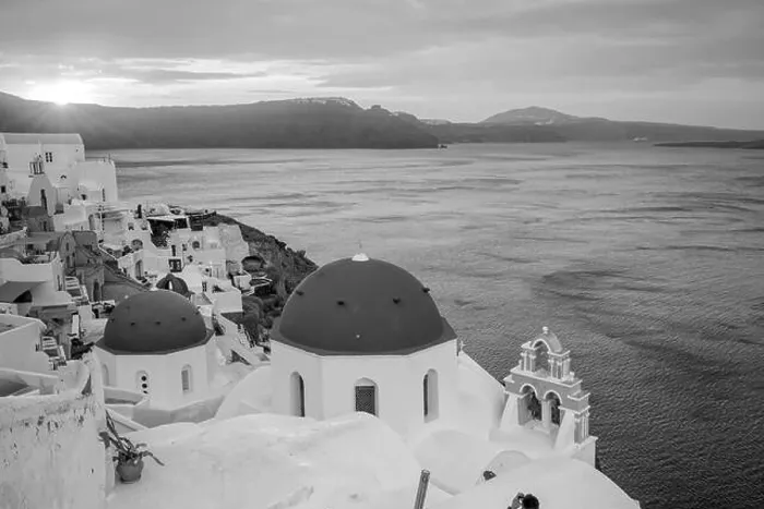 Framed Print : Oia town cityscape at Santorini island in Greece at sunset. Aegean sea in black and white Framed Print : Oia town cityscape at Santorini island in Greece at sunset. Aegean sea in black and white