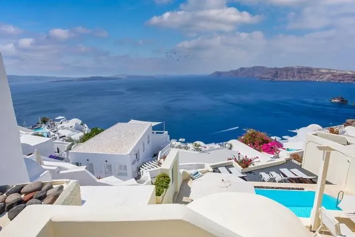 Framed Print : Oia town on Santorini island, Greece. Traditional famous white blue houses stairs, pathways under sunny blue sky Caldera, Aegean sea. Beautiful summer Framed Print : Oia town on Santorini island, Greece. Traditional famous white blue houses stairs, pathways under sunny blue sky Caldera, Aegean sea. Beautiful summer