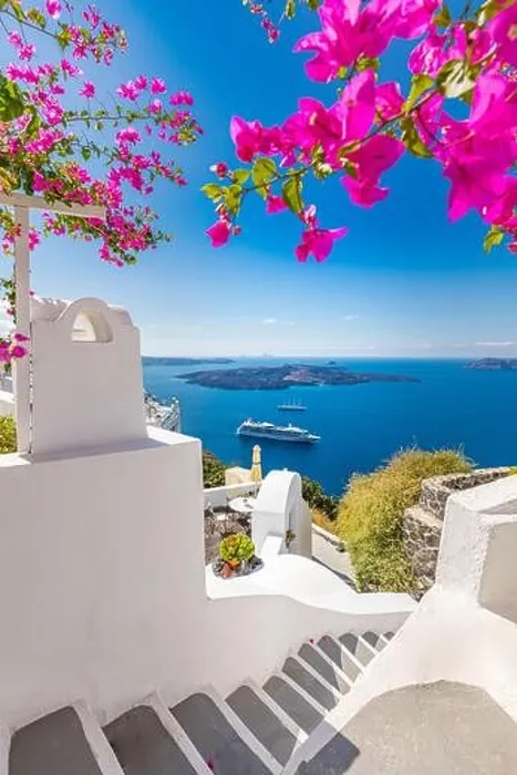 Framed Print : Oia town on Santorini island, Greece. Traditional famous white blue houses with flowers under sunny weather caldera, Aegean sea. Beautiful summer view Framed Print : Oia town on Santorini island, Greece. Traditional famous white blue houses with flowers under sunny weather caldera, Aegean sea. Beautiful summer view