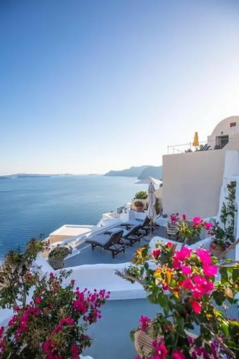Framed Print : Oia town on Santorini island, Greece. Traditional famous white blue houses with flowers under sunny weather caldera, Aegean sea. Beautiful summer view Framed Print : Oia town on Santorini island, Greece. Traditional famous white blue houses with flowers under sunny weather caldera, Aegean sea. Beautiful summer view