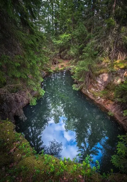 Framed Print : Old and historical mine full with greenish jade color water in middle of forest. This mine is over 500 hundred years old