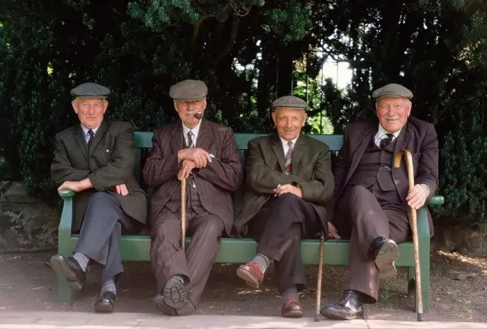 Framed Print : Four old men wearing cloth caps. Seated on park bench Framed Print : Four old men wearing cloth caps. Seated on park bench